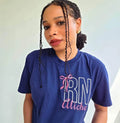 Person wearing a blue t-shirt with 'RN Aliche' design.custom-nurse-shirt