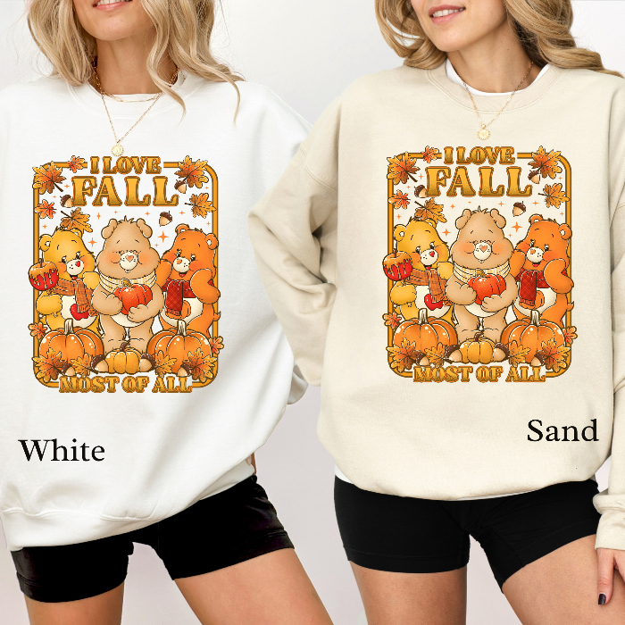 Two sweatshirts with 'I love Fall most of all' design featuring bears and pumpkins, one white and one sand color. cozy-fall-bear-sweatshirt