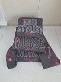 Gray headband with 'Hair Stylist', 'Nurse', and 'Makeup Artist' text on a white background