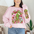 Person wearing a pink Christmas-themed sweatshirt with festive graphics.