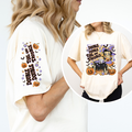 White t-shirt with Halloween-themed design featuring a witch and pumpkins, worn by a person.vintage-witch-halloween-tee