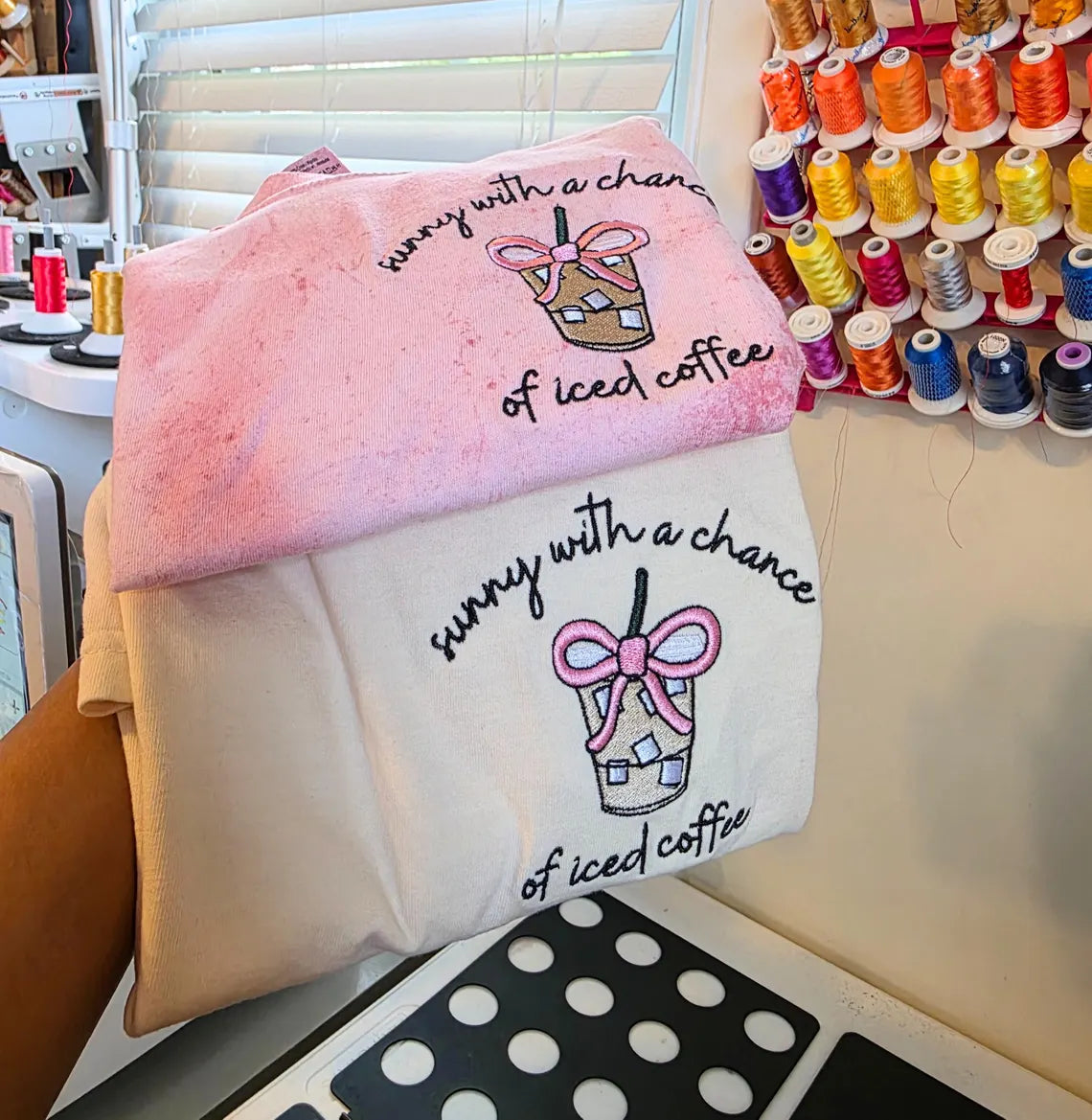 Two embroidered towels with coffee-themed design in a sewing room .but-first-coffee-shirt
setting.