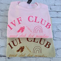 Pink and beige sweatshirt with 'IVF CLUB' text and graphics on a textured white background. ivf-sweatshirt