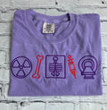 Folded purple t-shirt with medical-themed symbols on a textured surface.radiologist-t-shirt