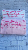Faith-inspired women’s sweatshirt with oversized fit and bow
