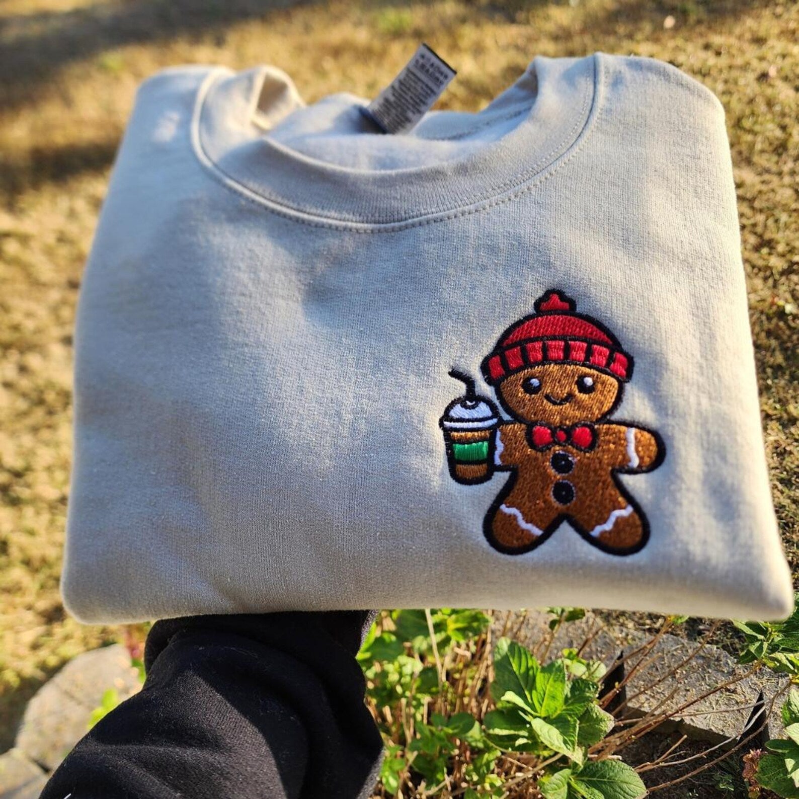 Close-up of gingerbread print on holiday sweatshirt