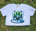White  Heartbeat Stethoscope T-Shirt, lying on a grassy surface.